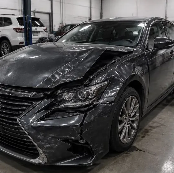 Dark sedan before the repair