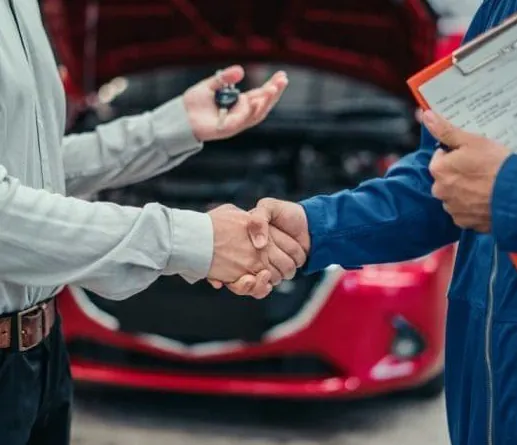 Customer handing car keys to a LIFT advisor